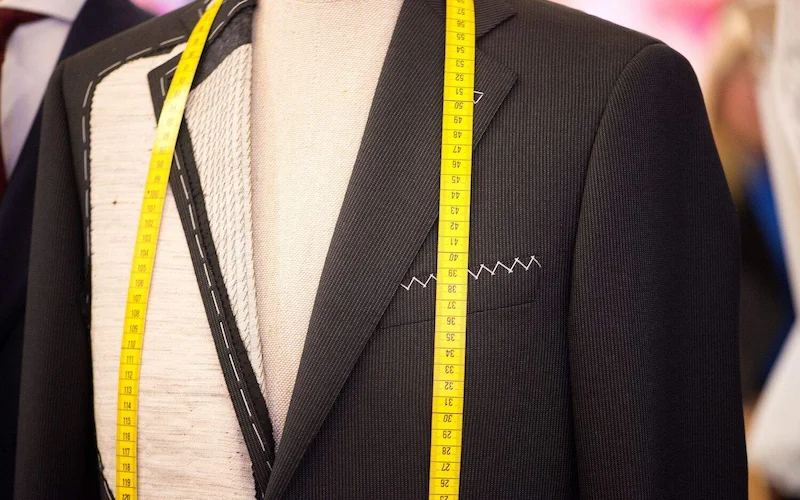 Tailored suit with measuring tape