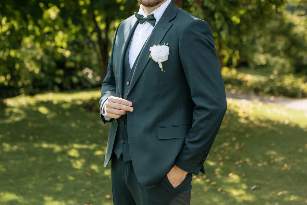Man in Deep Forest Green suit with boutonniere