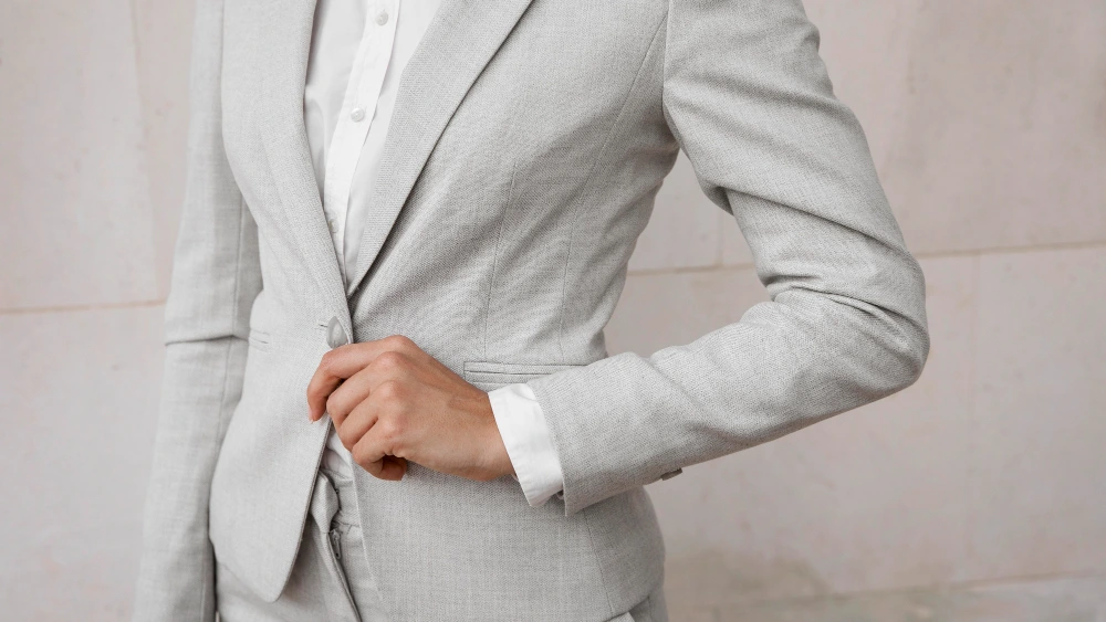 Close-up of a woman in a Light Grey suit
