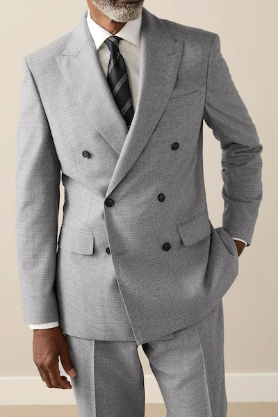 Man in a gray double-breasted suit