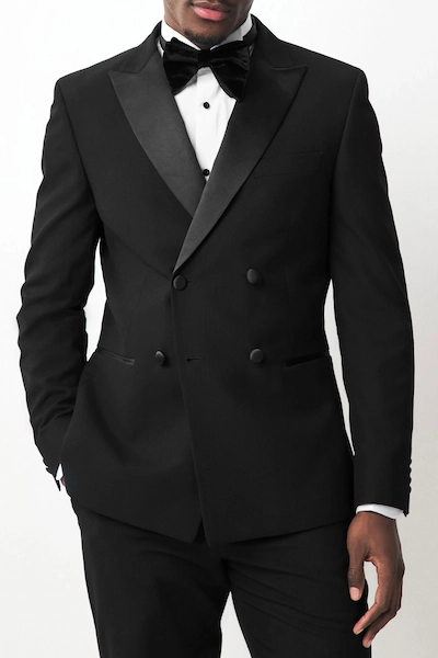 Man in a black tuxedo and bow tie
