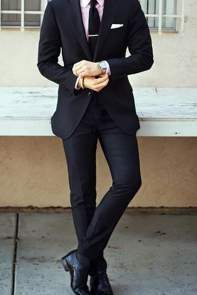 Man in a suit standing casually