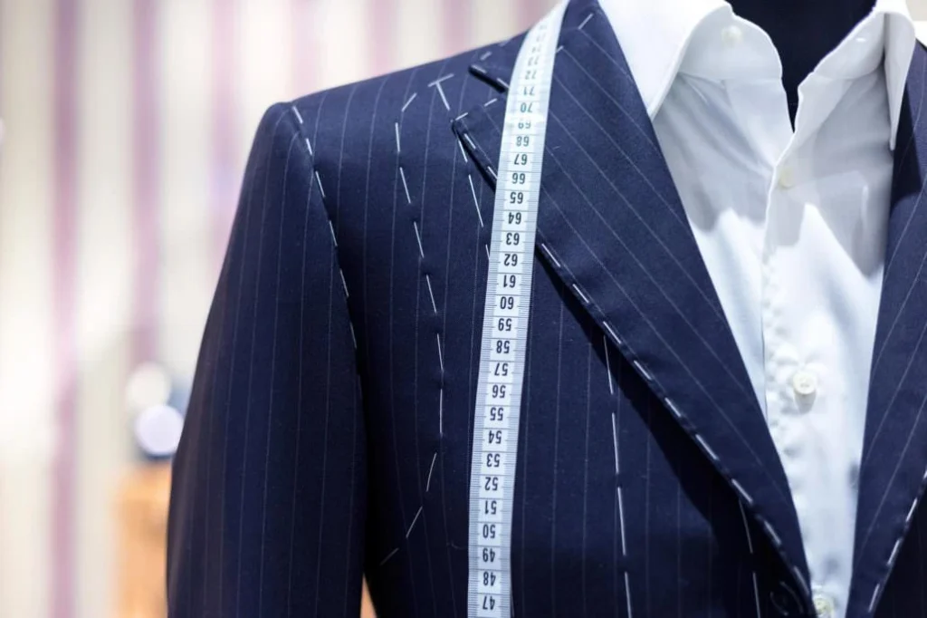 Tailored suit with measuring tape.