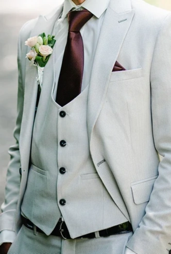 A single-breasted suit features a jacket with a single column of buttons and a narrow overlap. It is the most versatile suit style, suitable for both formal and casual settings. Available in various fits and fabrics, it offers a timeless and modern look for any occasion.